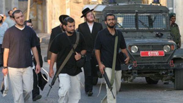 مستوطنون مسلحون في الضفة الغربية