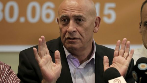 Basel Ghattas of the Israeli Knesset's Joint Arab List voluntarily gave up his parliamentary immunity and was slapped with a travel ban until the investigation was concluded. (AFP/File)
