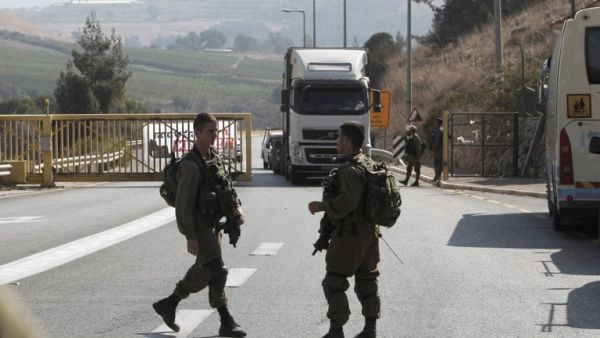 Israeli security forces are seen in the town of Metula, near the Lebanon-Israel border, on October 26, 2016, after gunfire from a vehicle in Lebanon towards Israeli forces wounded an Israeli soldier. (AFP/Jalaa Marey)