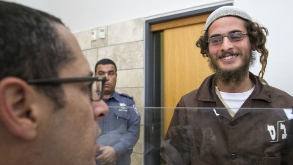Meir Ettinger, the alleged head of a Jewish extremist group, at the Magistrate's Court in Nazareth Illit on August 4, 2015, a day after his arrest. (AFP/Jack Guez)