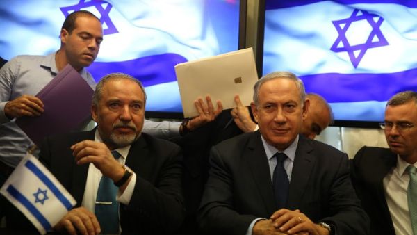 Israeli Prime Minister Benjamin Netanyahu and Avigdor Lieberman, the head of hardline nationalist party Israel Beiteinu, are seen during a ceremony signing a coalition agreement on May 25, 2016 at the Knesset. (AFP/Menahem Kahana)