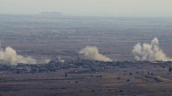 A picture taken from the Israeli-occupied Golan Heights on September 10, 2016 shows smoke rising from the Syrian village of Jubata al-Khashab after Israeli airstrikes against Syrian army positions. (AFP)