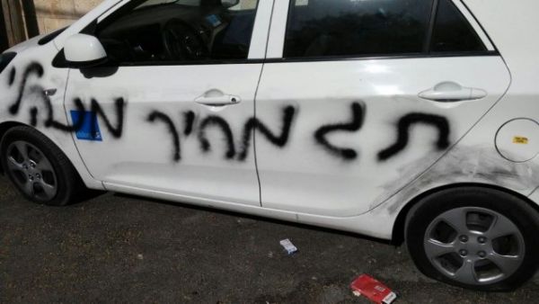 A car daubed with 'administrative price tag' in East Jerusalem, May 9, 2017. (Amar Arouri/B'Tselem)