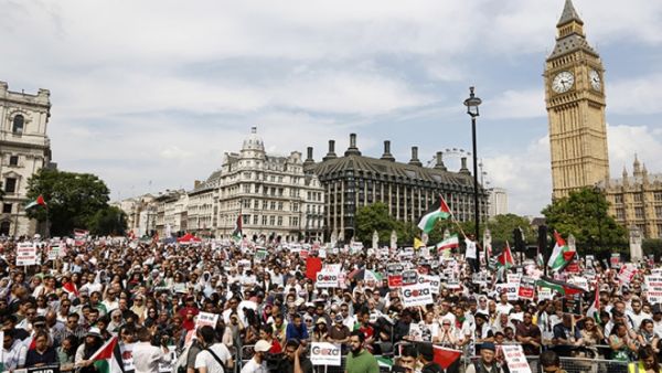 Demonstrators gather outside the Houses of Parliament after marching from outside the Israeli embassy in central London on July 26, 2014, calling for an end to violence in Gaza. (AFP/Justin Tallis)