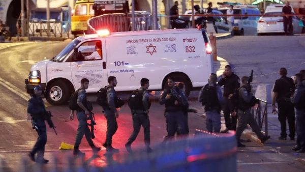 Israeli security forces and an ambulance are seen at the scene of an attack outside Damascus Gate in Jerusalem's Old City on June 16, 2017. (Thomas Coex/AFP)