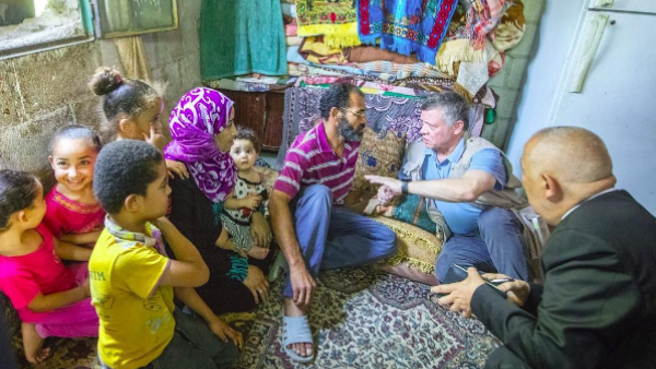 Jordan's King Abdullah II pays surprise visits to underprivileged families in Deir Alla District. (Royal Hashemite Court)