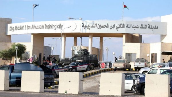 Police officers and security forces stand guard outside a police training center east of Amman on November 9, 2015, where a Jordanian officer shot dead five fellow trainees. (AFP/Stringer)