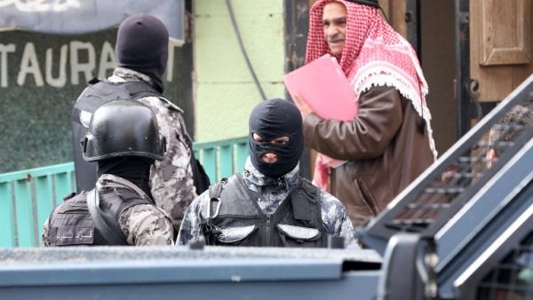 Jordanian security forces stand guard near the Crusader castle on December 19, 2016 in Karak, around 70 miles south of Amman, a day after an attack killed 10 people, including a Canadian tourist. (AFP/Khalil Mazraawi)