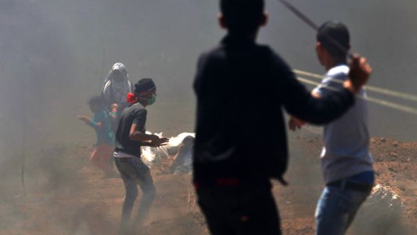 Palestinian children use slingshots during clashes with Israeli forces  (AFP/File Photo)