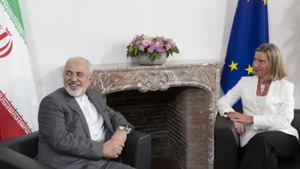 Iranian Foreign Minister Mohammad Javad Zarif (L) meets with European Union Foreign Policy Chief Federica Mogherini, to discuss Iran's nuclear deal/AFP