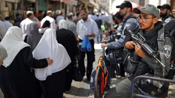 Israeli police stand guard in the main street of the Muslim Quarter in Jerusalem's Old City (AFP/File Photo)