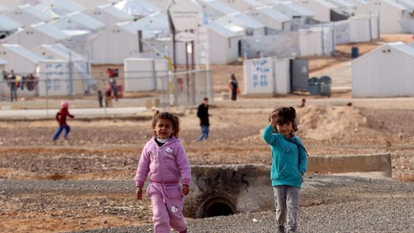 Young Syrian refugees stand around at the Azraq refugee camp in northern Jordan. (Khalil Mazraawi/AFP)