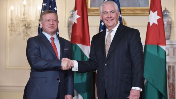 US Secretary of State Rex Tillerson (R) poses for a photo with Jordan's King Abdullah II ahead of a working lunch at the State Department in Washington, DC on April 4, 2017. (AFP/Mandel Ngan)