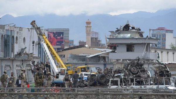 Afghan forces gather at the site of a car bomb in Kabul on April 19. (AFP/Shah Marai) Afghan forces gather at the site of a car bomb in Kabul on April 19. (AFP/Shah Marai)