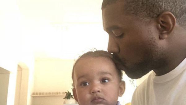 Aww: Kanye West showed his softer side as he took to Twitter on Monday to share an adorable photo of himself kissing seven-month-old daughter Chicago on the head (Source: Kanye West - Twitter)