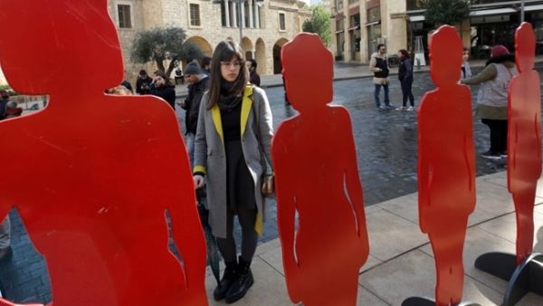 Figures representing women, killed by male relatives in Lebanon, including eight killed in the past 60 days, during a rally organized by activists. (AFP / ANWAR AMRO)
