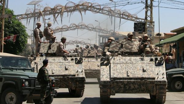 Lebanese soldiers patrol the Christian village of al-Qaa, near the country's border with war-ravaged Syria, on June 28, 2016 after two waves of suicide bombings struck the village killing and wounding several people. (AFP/Stringer)