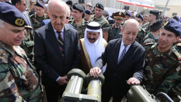 (L to R) Lebanese Army chief Jean General Jean Kahwaji, Lebanese Defende Minister Samir Moqbel, Saudi Ambassador to Lebanon Ali Awad Asiri and French Defende minister Jean-Yves Le Drian take part in a hand-over ceremony of a shipment of Saudi-funded French weapons to the Lebanese Army at Beirut International Airport on 20 April, 2015. (AFP/File)