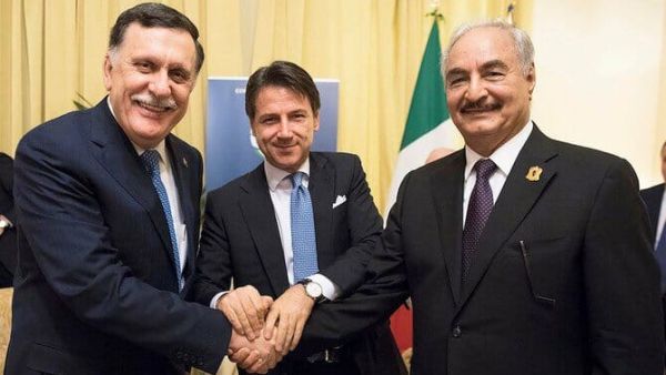 Italian PM Giuseppe Conte (C) posing with head of Libya's GNA Fayez Al- Sarraj (L) and commander of LNA Khalifa Haftar in Palermo. (AFP)