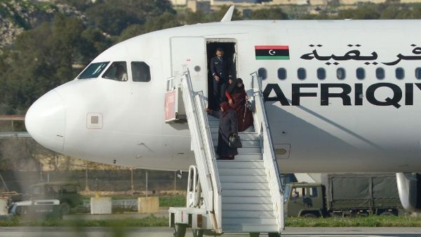 A group of hostages is released from a hijacked Afriqiyah Airways plane in Malta on December 23, 2016. (AFP/Matthew Mirabelli)