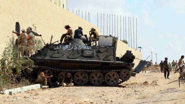 Forces loyal to Libya's Government of National Accord (GNA) hold a position in the area known as District Three in the west of the coastal city of Sirte on September 3, 2016 as they attack the last positions of Daesh in the city. (AFP/Mahmud Turkia)