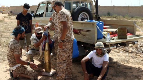 Fighters from forces loyal to Libya's Unity Government gather next to a pick up truck on July 2, 2016 as they take position to hit Daesh targets in Sirte during an operation to recapture the coastal city. (AFP/Mahmud Turkia) Fighters from forces loyal to Libya's Unity Government gather next to a pick up truck on July 2, 2016 as they take position to hit Daesh targets in Sirte during an operation to recapture the coastal city. (AFP/Mahmud Turkia)
