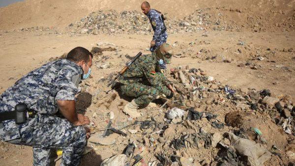 Iraqi soldiers check a mass grave they discovered in the Hamam al-Alil area on November 7, 2016, after they recaptured the area from Islamic State of Iraq. (AFP/File)