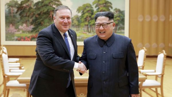 US Secretary of State Mike Pompeo, left, with North Korea leader Kim Jong Un (AFP Photo)