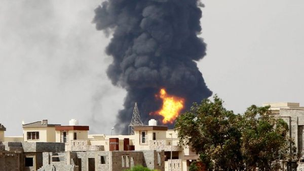 Column of smoke billowing over Tripoli, Libya. (AFP/File)

