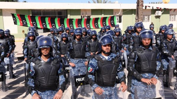 Members of the Libyan judicial police pose after a graduation ceremony. (AFP/Mahmud Turkia)