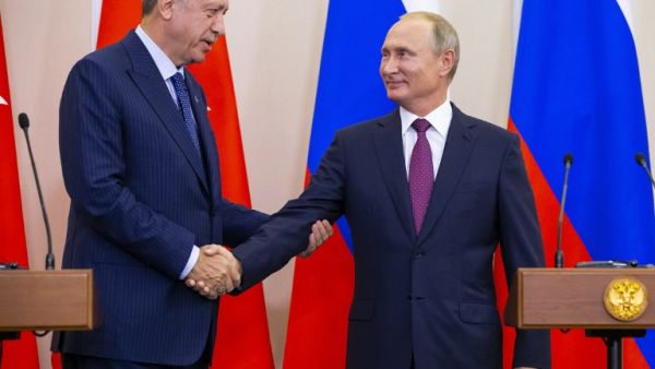 Russian President Vladimir Putin (R) shakes hands with Turkish President Recep Tayyip Erdogan after their joint press conference following the talks, in the Bocharov Ruchei residence in the Black Sea resort of Sochi in Sochi on September 17, 2018/AFP