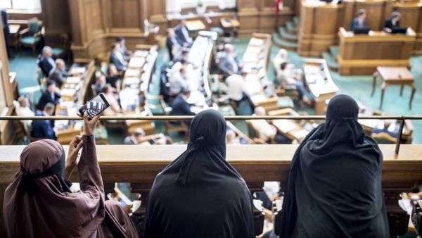 Women wearing burqa sit in the audience at the Danish Parliament in Copenhagen, Denmark, in May 2018. (AFP/File Photo)
