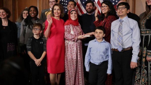 Speaker of the House Nancy Pelosi with Rep. Rashida Tlaib and her family in the Rayburn Room at the U.S. Capitol January 03, 2019 in Washington, DC. (AFP)