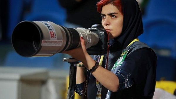 In an act of defiance, Parisa Pourtaherian covered a men football match but from a terrace of a building located near the stadium. (Parisa Pourtaherian/Instagram)