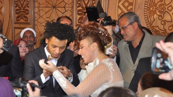 Mai Kassab and Oka celebrating holy matrimony.