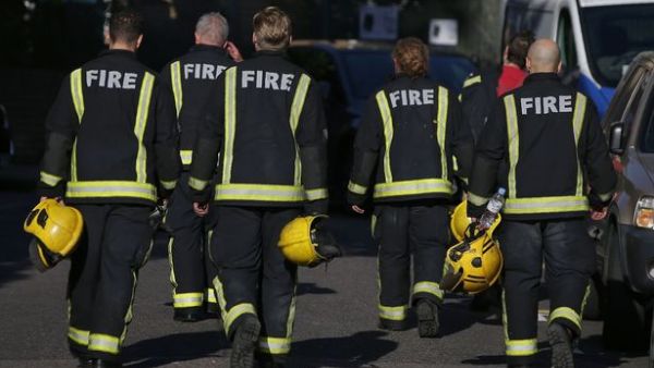 Members of the Fire Brigade walk near Manchester Arena (AFP/File Photo)	
