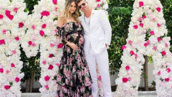 The couple shared photos from their baby shower, which took place on January 20, which showed a wall of flowers spelling out 'MIA' (Source: aprillovegeary - Instagram)