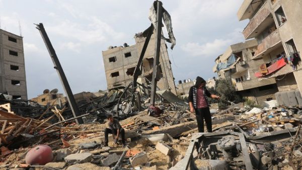 A Palestinian stands amidst the rubble of the building housing the Hamas-run television station al-Aqsa TV, destroyed by an Israeli airstrike. (MAHMUD HAMS / AFP)