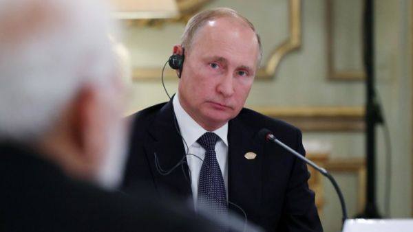 Russia's President Vladimir Putin (L) is pictured during a meeting with India's Prime Minister Narendra Modi (R) and China's President Xi Jinping (out of frame), in the sidelines of the G20 Summit in Buenos Aires. (AFP)