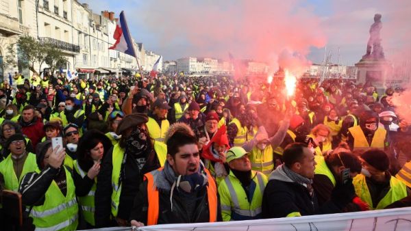 People march on January 5, 2019 in La Rochelle during a demonstration called by the yellow vests (gilets jaunes) movement for the eighth week in a row. (Xavier LEOTY / AFP)