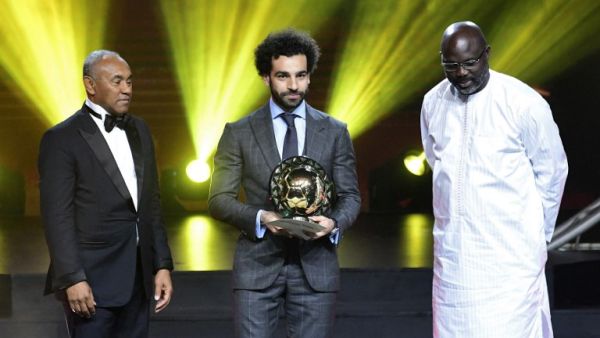 Confederation of African Football (CAF) President Ahmad Ahmad (L) poses after he handovered the 2018 African Footballer of the Year Award to Mohamed Salah. (AFP/File)