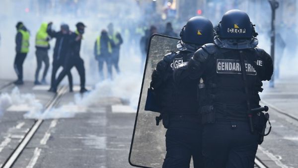 French gendarmes of the CIOP (cellule image ordre public) face protestors during an anti-government demonstration called by the yellow vest "Gilets Jaunes" movement. (AFP)