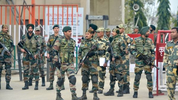 Indian security forces stand guard near the India-Pakistan border in Wagah on March 1, 2019, as they wait for the return of an Indian Air Force pilot being returned by Pakistan. (AFP/File)