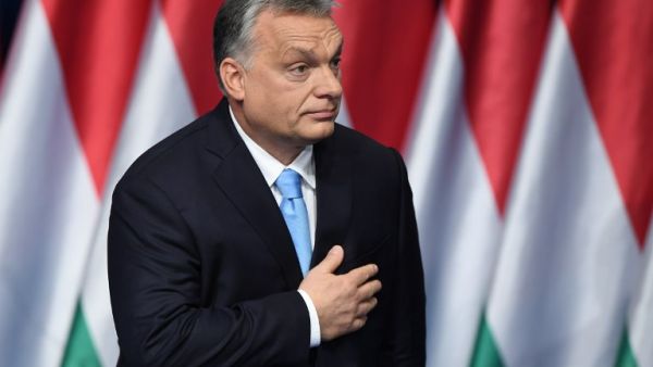 Hungarian Prime Minister and Chairman of FIDESZ party Viktor Orban reacts after delivering his state of the nation speech in front of his party members and sympathizers at Varkert Bazar cultural center in Budapest. (AFP)
