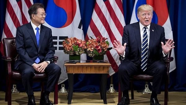 South Korea's President Moon Jae-in (L) listens as US President Donald Trump speaks to the press before a meeting at New York's Palace Hotel. (AFP)