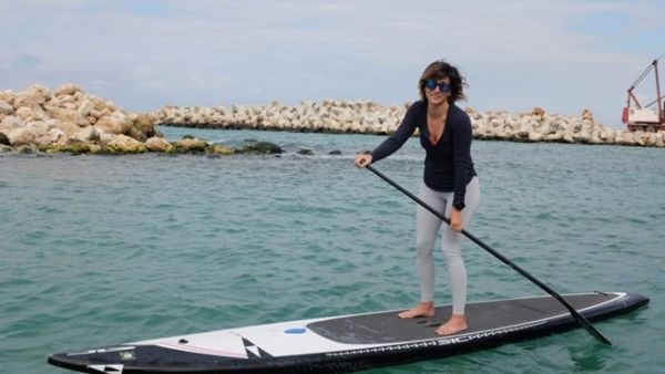 Caroline Raphael trains for her SUP challenge in Jounieh, Tuesday, Feb. 12, 2019. (The Daily Star/Finbar Anderson)