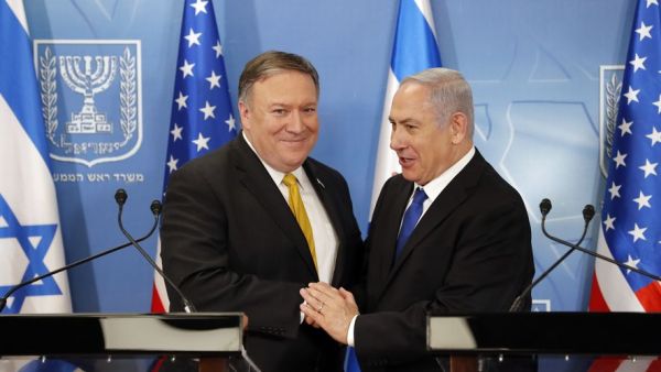 U.S. Secretary of State Mike Pompeo. left. is greeted by Israeli Prime Minister Benjamin Netanyahu. (AFP/File)