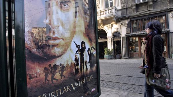 Woman passes by 'Turkish James Bond' film poster. (AFP/ File) Woman passes by 'Turkish James Bond' film poster. (AFP/ File)
