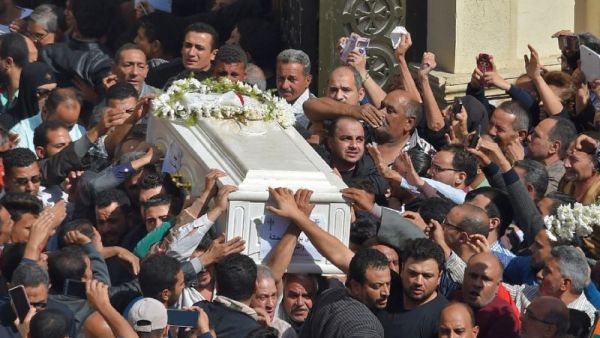Coptic Christians carry the coffin of a victim killed in an IS-claimed attack that took place on Friday against pilgrims in Egypt's Minya province. (AFP Photo/MOHAMED EL-SHAHED )
