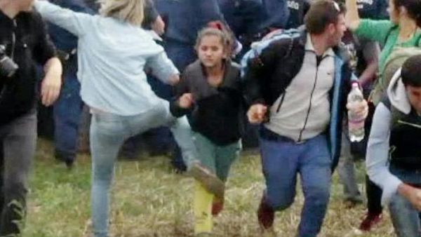 Hungarian TV camerawoman Petra Laszlo kicks a running child as refugees flee border police near the Serbian border with Hungary. (AFP/File)